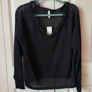 Woman’s oversized light sweater-